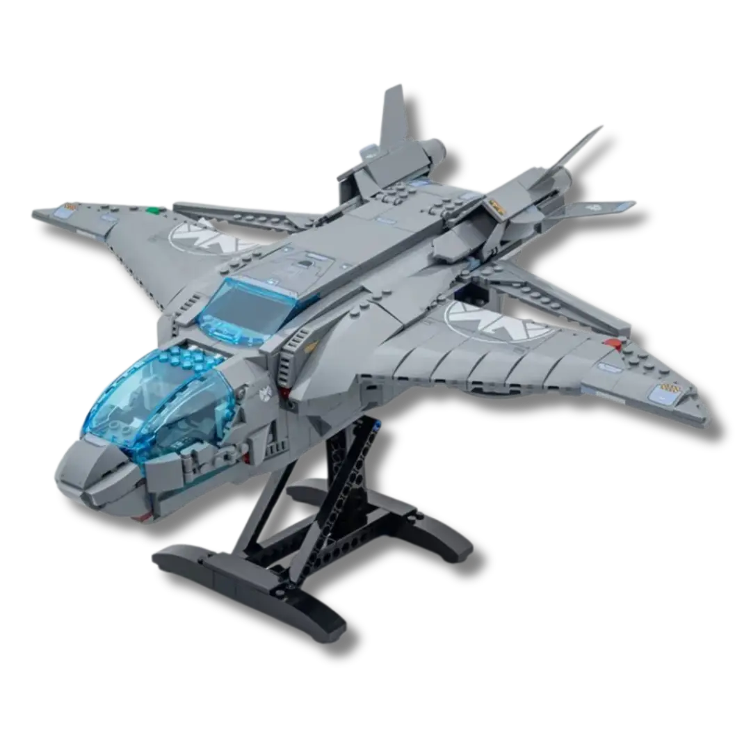 Brick-built Marvel Avengers Quinjet model displayed on a stand, featuring a gray body, transparent blue cockpit, adjustable wings, and S.H.I.E.L.D. insignias